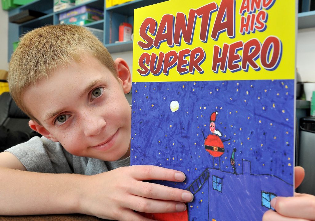 MARIO BARTEL/THE TRI-CITY NEWS Nathan McTaggart, 11, found his inspiration for his first children's book from the imaginary scenarios he conjured with his dad, Keven, instead of reading from traditional storybooks.